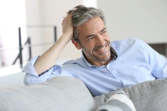 Smiling handsome mature man at home