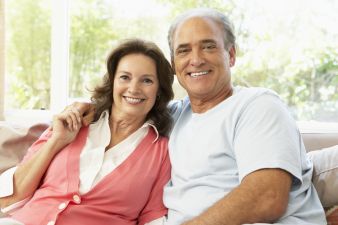 Hispanic Senior Couple Relaxing At Home