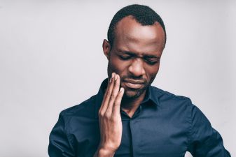 african american man with a aching tooth