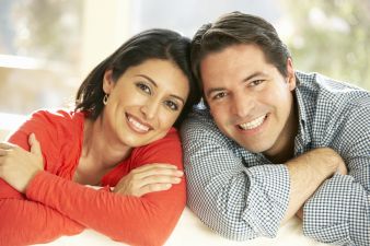 Hispanic Couple Relaxing At Home