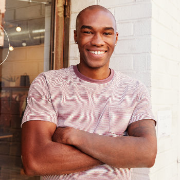 Young African American man healthy smile Elegant Smiles