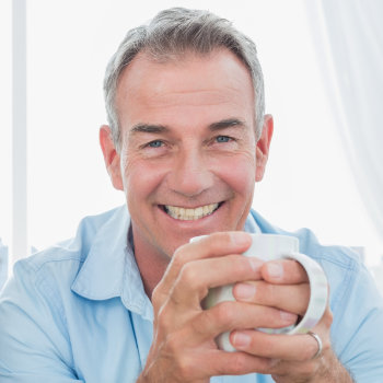 Smiling middle aged men Elegant Smiles patient group