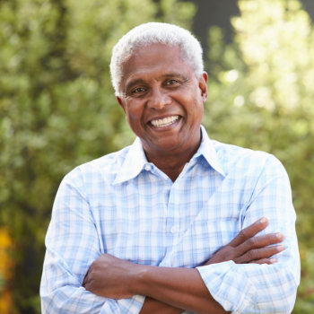 Smiling senior African American man Dental Care for Seniors Roswell