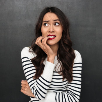 Worried woman dental anxiety Elegant Smiles care