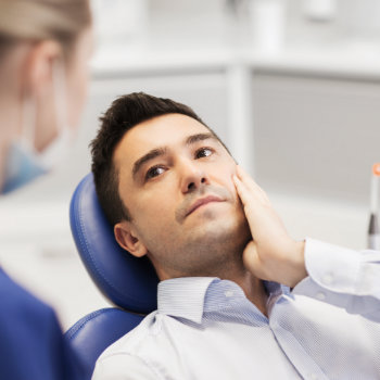 Tooth Pain Relief man in dental chair Emergency Dental Care Roswell