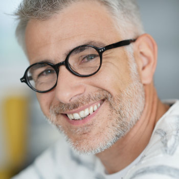 Handsome mature man with glasses Elegant Smiles care