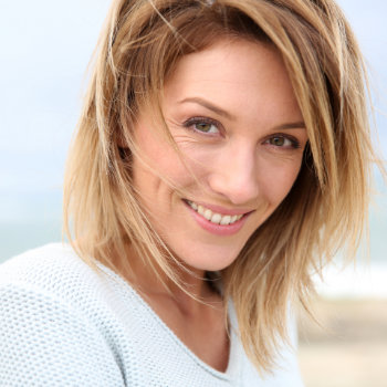 Mature blonde woman smiling Elegant Smiles patient