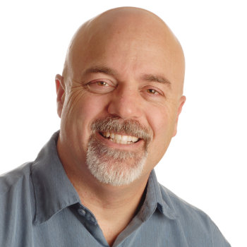 Middle aged man smiling Elegant Smiles patient image