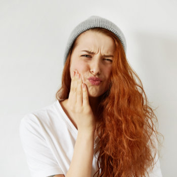 Redhead girl tooth pain Emergency Dental Care in Roswell image