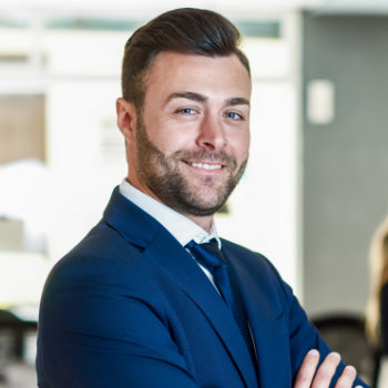 Smiling handsome businessman Elegant Smiles patient