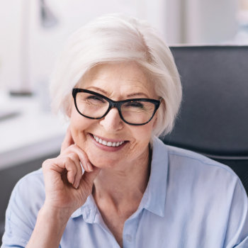 Smiling senior woman with glasses Elegant Smiles care