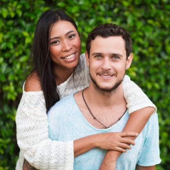 Young couple smiling Elegant Smiles dental care visit